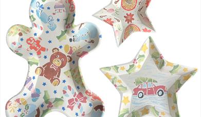 Gingerbread man, large and small star shaped dishes/bowls with Christmas designs printed on them.