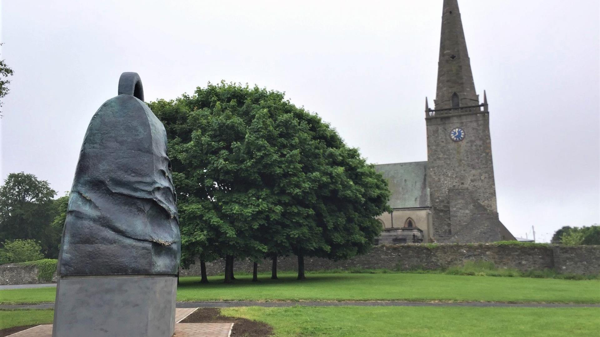 Statue of The Bangor Bell outside of Bangor Abbey in the city