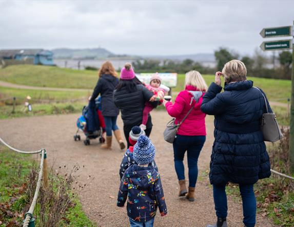 Family walking along a path on the Castle Espie reserve