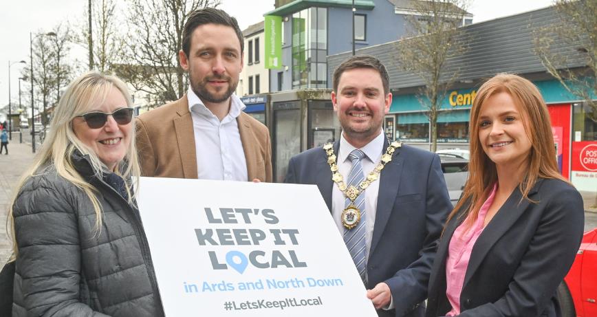 Photo caption: Pictured in High Street, Holywood, are Eileen Milligan (Penrhyn Photography), Gavin Dumigan (Focus Menswear), Deputy Mayor Craig Blaney and Charlotte McClean (The Old Inn). Image: Simon Graham Photography.

