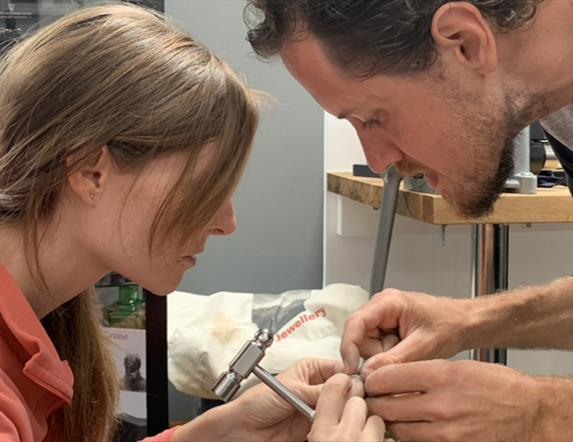 Man and Woman Making Wedding Rings Together