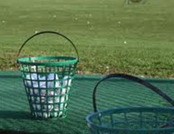 Image of full ball bucket ready for use at the driving range