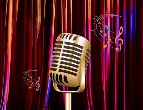 Vintage microphone on stage in front of curtains