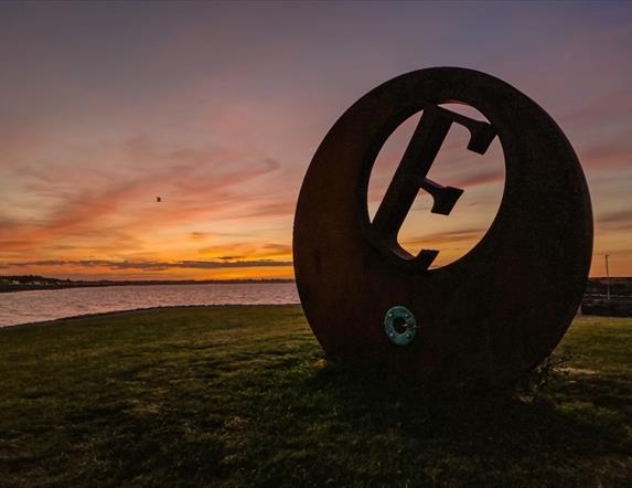 Sunset at Burr Point Ballyhalbert, E sculpture marking the most easterly point on the Island.