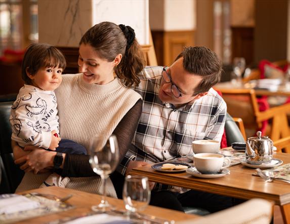 Female, male and young boy sitting in The Old Inn restuarant