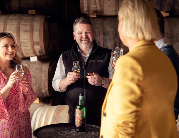 Tour group enjoys a tasting at Echlinville Distillery