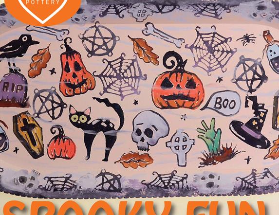 Pottery plate decorated with Halloween themed prints