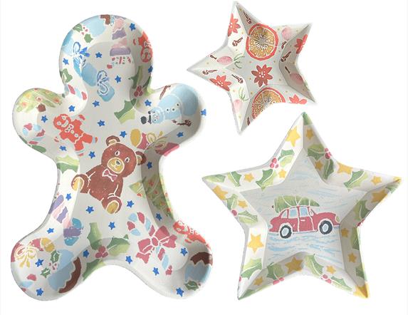 Gingerbread man, large and small star shaped dishes/bowls with Christmas designs printed on them.