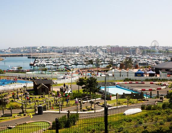 Photo taken on a summers day with a view over Pickie Funpark and the marina