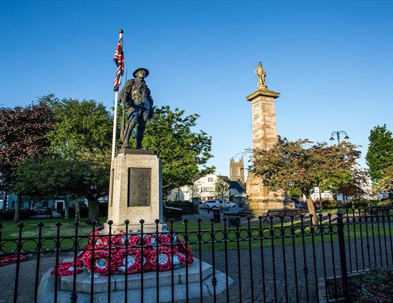 Photo of the Rollo Gillespie Monument standing tall in the centre of Comber Square