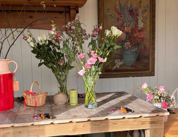 Table with vases of flowers