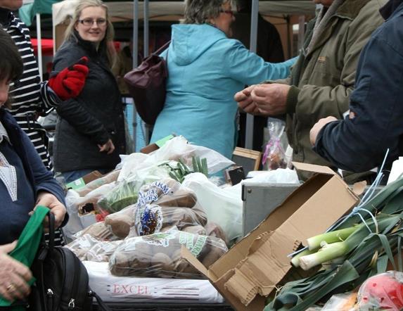 photograph showing traders and customers at the comber farmers market