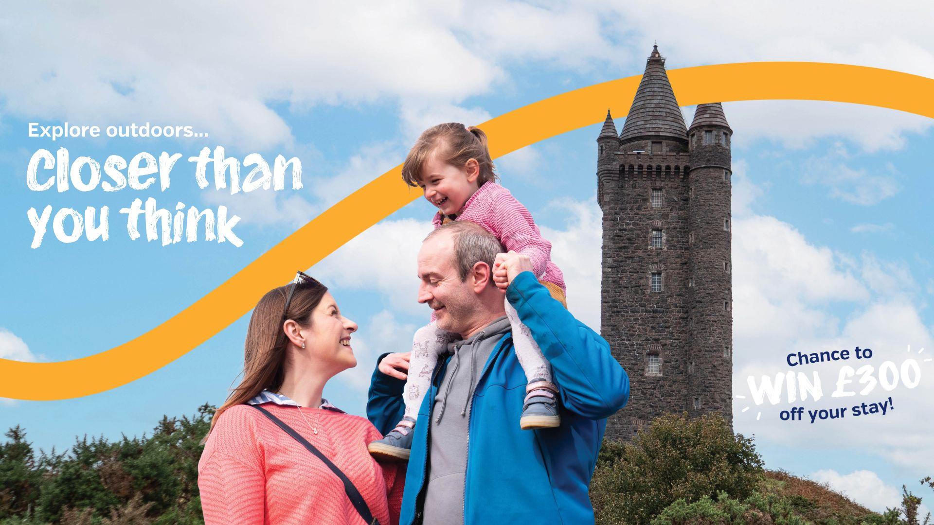 Family at Scrabo Tower, woman, man and child with text Explore outdoors... Closer than you think!