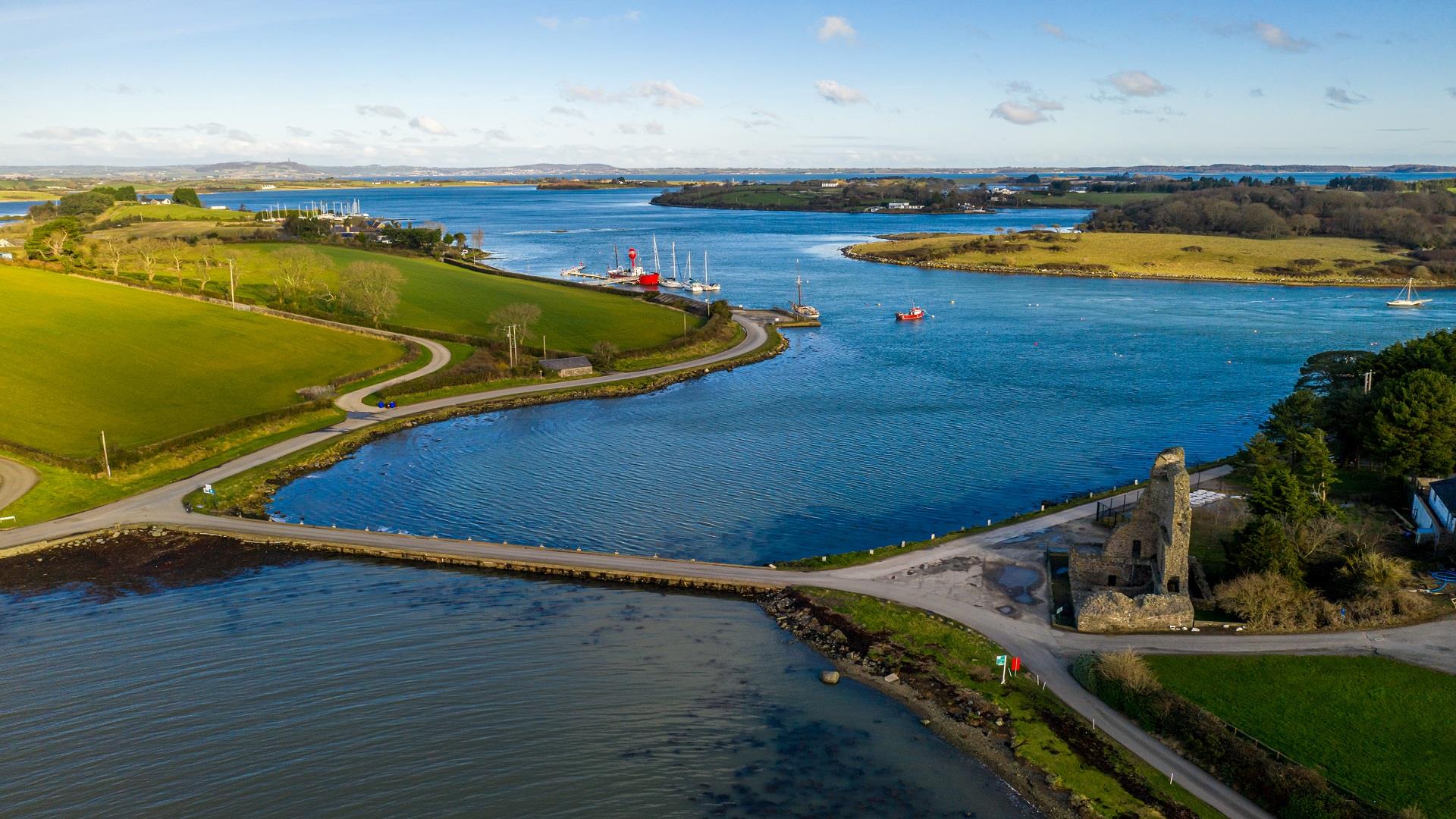A birds eye view of Sketrick Island and the lough area surrounding it showcasing the stunning region