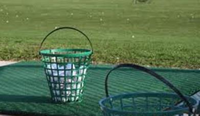 Image of full ball bucket ready for use at the driving range