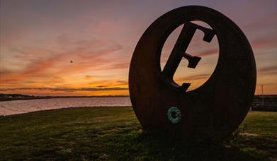 Sunset at Burr Point Ballyhalbert, E sculpture marking the most easterly point on the Island.