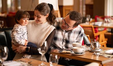 Female, male and young boy sitting in The Old Inn restuarant