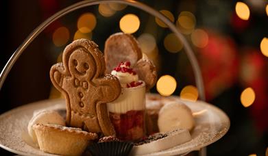 Plate with gingerbread person, mince pies and mini trifle 
