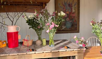 Table with vases of flowers