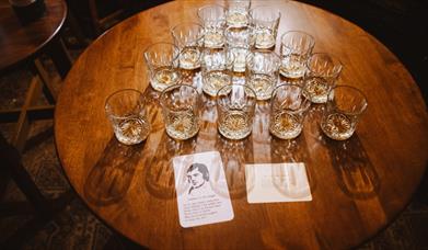 Dram of whiskey set out on a table