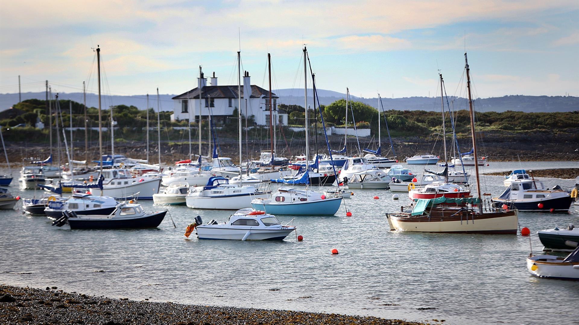 A photograph of boats in the water at the harbour