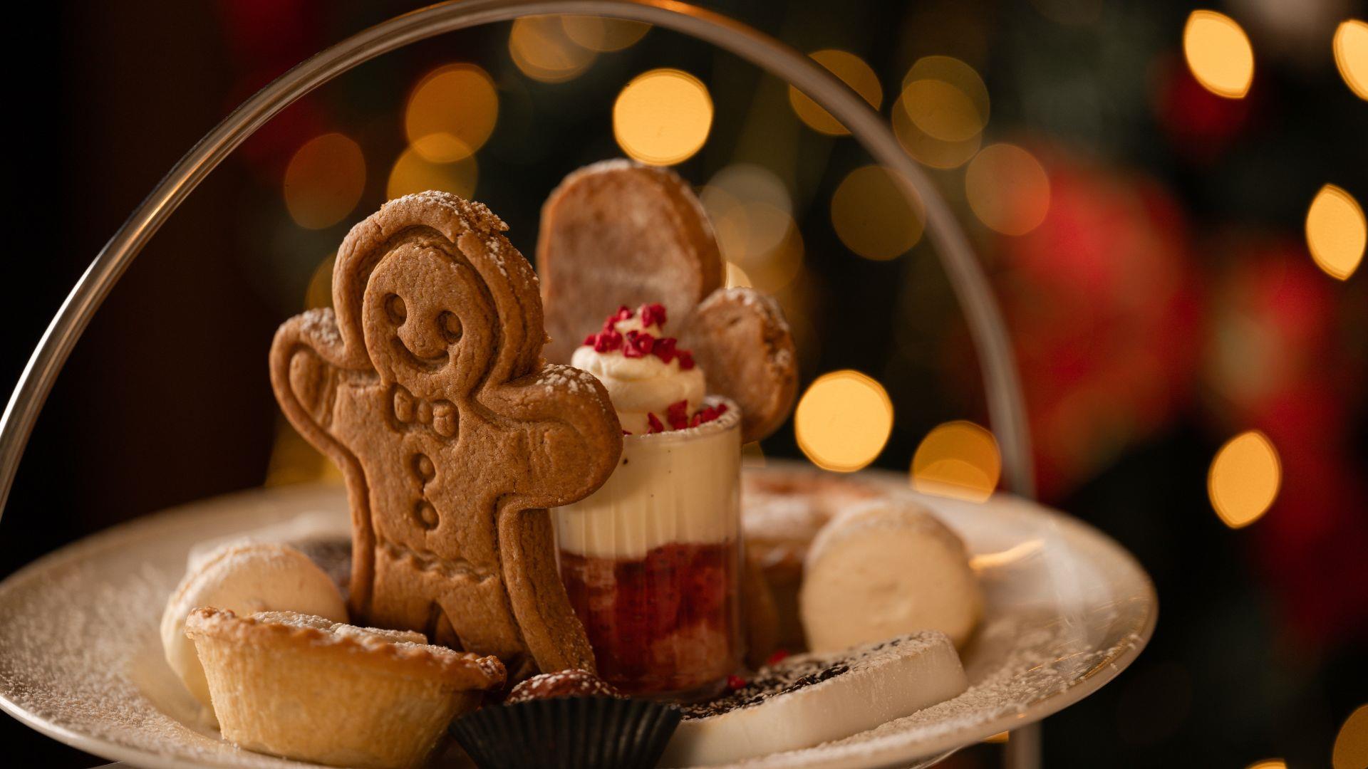 Plate with gingerbread person, mince pies and mini trifle
