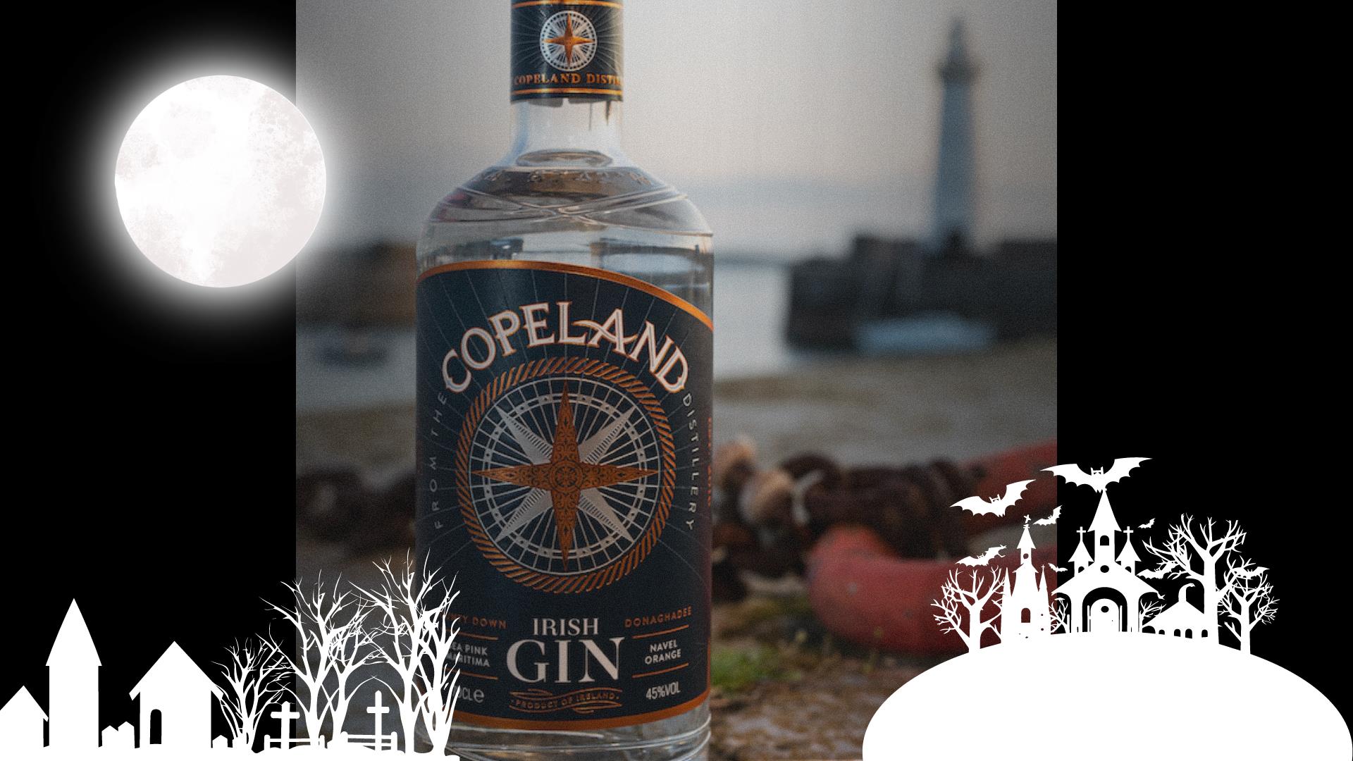 A bottle of Copeland Gin with Donaghadee Lighthouse in the background, with an overlay of spooky themed graphics for Hallowe'en