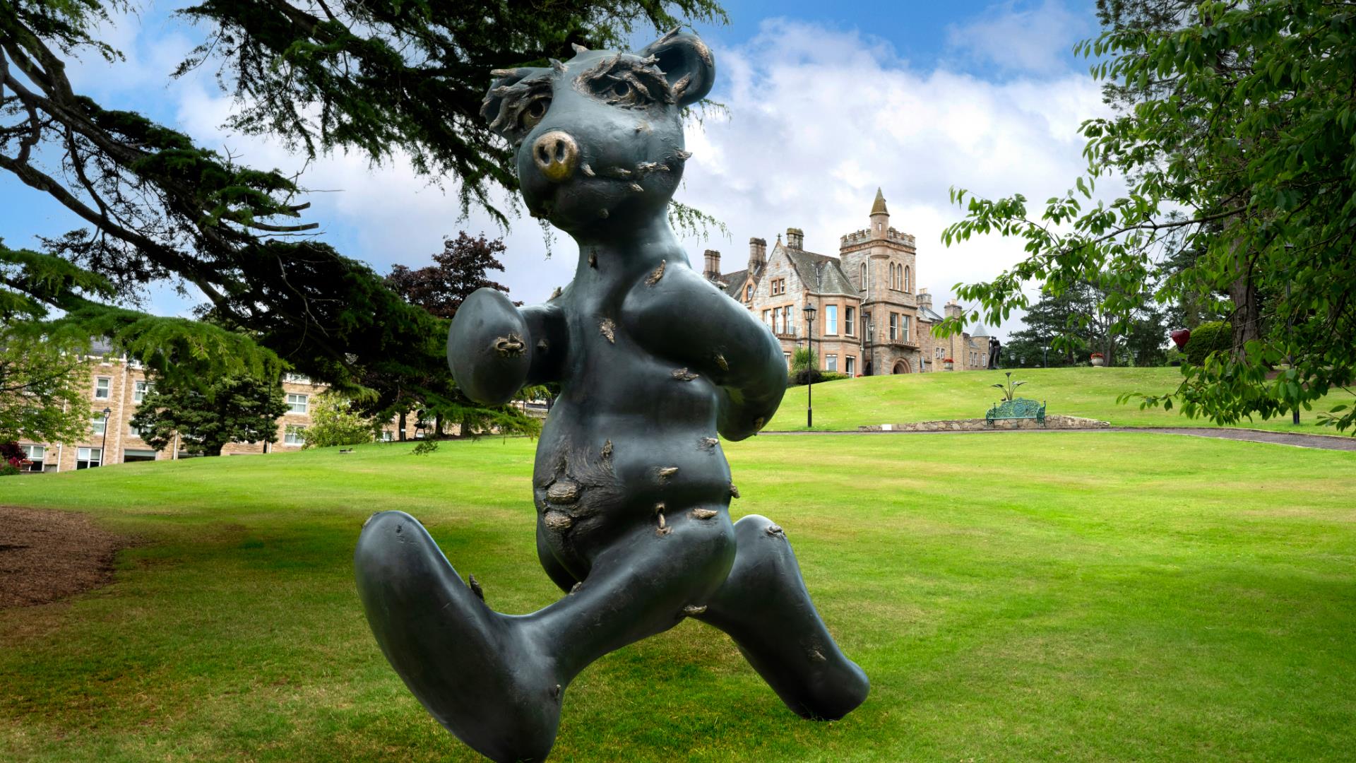 Lost in Reverie Bear bronze sculpture by Patrick O'Reilly in the grounds of the Culloden Estate & Spa