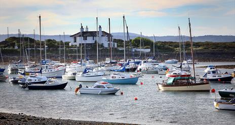 A photograph of boats in the water at the harbour