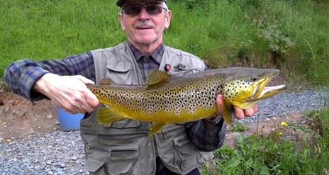 Genteman holding a large fish