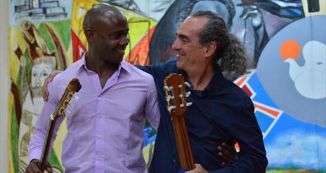 Eduardo Martin and Ahmed Dickinson Cárdenas with guitars