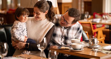 Female, male and young boy sitting in The Old Inn restuarant