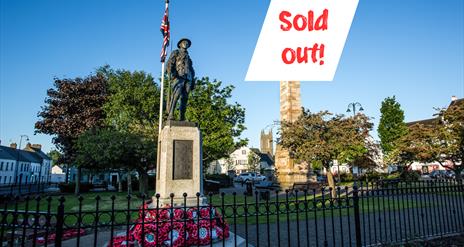 Photo of the Rollo Gillespie Monument standing tall in the centre of Comber Square with text Sold Out