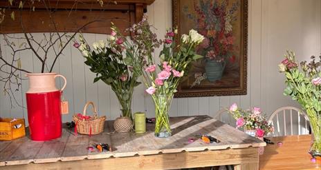 Table with vases of flowers