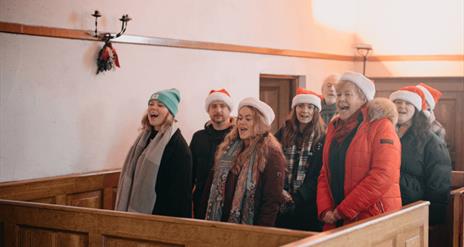 The Fortwilliam Musical Society singing in the Church at Ulster Folk Musuem