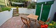 Garden with patio seating area