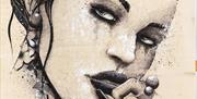 Close up image of one of artist Terry Bradley's stunning  paintings, this one is of a woman's face in black and white