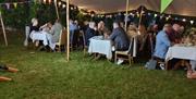People sitting in the walled garden at No.14 The Georgian House Comber