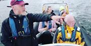 Men on boat pointing
