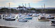 A photograph of boats in the water at the harbour