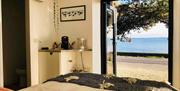 Bedroom with double doors looking out to stunning scenery