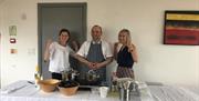 Three participants ready to start baking
