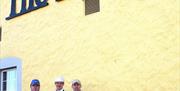 Photo of Chef's standing outside the restaurant