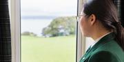 A pupil looking out to the view across Belfast Lough