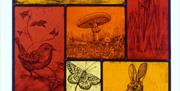 Stained glass window of nature scenes