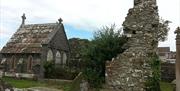 Photograph of the Movilla Abbey, grave stones and ruins