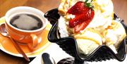 Photo of an ice cream dessert and coffee