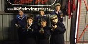 A group of children posing for a photo ready to play laser quest