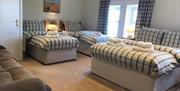 Triple bedroom, one double and two twin beds