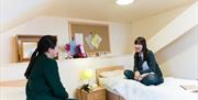 Two pupils in their dorm